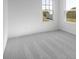 This bedroom features soft gray carpeting and a double window for lots of light at 567 Hidden Hills Dr, Pittsboro, IN 46167
