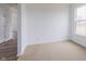 Bright bedroom with a large window and neutral carpet at 567 Hidden Hills Dr, Pittsboro, IN 46167