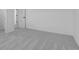 The bedroom has soft, neutral carpeting and a doorway, featuring light walls and trim at 567 Hidden Hills Dr, Pittsboro, IN 46167
