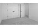 The bedroom is well lit and has neutral carpeting, along with paneled closet doors at 567 Hidden Hills Dr, Pittsboro, IN 46167