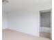 A bright bedroom features neutral carpet, white walls, a ceiling light, and an attached bathroom at 567 Hidden Hills Dr, Pittsboro, IN 46167