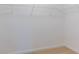 White wire racks offer ample storage in this carpeted walk-in closet at 567 Hidden Hills Dr, Pittsboro, IN 46167