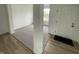 Welcoming entryway with light wood floors, neutral walls, and a view of the living area at 567 Hidden Hills Dr, Pittsboro, IN 46167