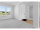 Entryway with grey carpet, a white door, and a window view to the outside at 567 Hidden Hills Dr, Pittsboro, IN 46167