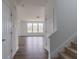 Hallway with stairway leading to a naturally lit living room at 567 Hidden Hills Dr, Pittsboro, IN 46167