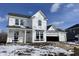 Two-story home showing construction details with a three car garage and covered porch at 567 Hidden Hills Dr, Pittsboro, IN 46167