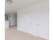 Hallway with carpet, white doors, and open view to other rooms at 567 Hidden Hills Dr, Pittsboro, IN 46167