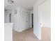 Bright hallway featuring carpet, closets, and doors to other rooms at 567 Hidden Hills Dr, Pittsboro, IN 46167