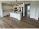 Modern kitchen with white cabinetry, stainless steel appliances, and a center island at 567 Hidden Hills Dr, Pittsboro, IN 46167