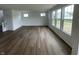 Spacious living room featuring hardwood floors, neutral walls, and plenty of natural light at 567 Hidden Hills Dr, Pittsboro, IN 46167