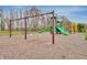 Community playground featuring a swing set, slide, and soft ground covering at 567 Hidden Hills Dr, Pittsboro, IN 46167