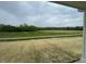 Scenic view from the porch overlooking lush green fields and distant trees at 567 Hidden Hills Dr, Pittsboro, IN 46167