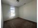 Bedroom with neutral carpet, a window for natural light and electrical outlets for convenience at 6405 Oyster Key Ln, Plainfield, IN 46168