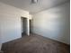 Bedroom offering a view of the walk-in closet with neutral carpet and closet space at 6405 Oyster Key Ln, Plainfield, IN 46168