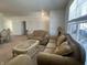 Comfortable living room with classic furnishings, a window view, and neutral tones at 6405 Oyster Key Ln, Plainfield, IN 46168