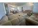 Cozy living room and dining area featuring classic sofas and a dining set at 6405 Oyster Key Ln, Plainfield, IN 46168