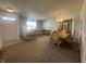 Spacious living room with carpeted floors, traditional furnishings, and ample natural light at 6405 Oyster Key Ln, Plainfield, IN 46168