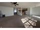 Open floorplan featuring carpeted living room that connects to the kitchen at 6405 Oyster Key Ln, Plainfield, IN 46168