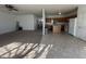 Open floorplan with kitchen, living and dining areas, featuring a ceiling fan at 6405 Oyster Key Ln, Plainfield, IN 46168