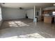 Open floorplan that connects living and kitchen, featuring ceiling fan and natural light at 6405 Oyster Key Ln, Plainfield, IN 46168