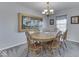 Traditional dining room with carpet, chandelier, and large hot air balloon stained glass at 644 Downing Dr, Greenwood, IN 46143