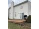 View of a house with an outdoor wooden deck, sliding glass doors, grill, and chimney at 7659 Misty Meadow Dr, Indianapolis, IN 46217