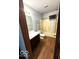 Bathroom with tub, shower, dark wood cabinets, and modern finishes at 7659 Misty Meadow Dr, Indianapolis, IN 46217