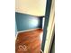 Bedroom with hardwood flooring and painted blue walls at 7659 Misty Meadow Dr, Indianapolis, IN 46217