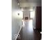 Hallway view of fireplace and hardwood floors at 7659 Misty Meadow Dr, Indianapolis, IN 46217