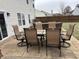 Patio with outdoor dining table and chairs plus plush seating and a sliding glass door to the home at 8048 Garden Ridge Rd, Indianapolis, IN 46237