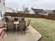 Backyard with a patio, dining table, chairs, seating, a privacy fence and green grass at 8048 Garden Ridge Rd, Indianapolis, IN 46237