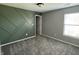 Bedroom featuring an accent wall with a geometric pattern at 8048 Garden Ridge Rd, Indianapolis, IN 46237