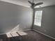 Cozy bedroom with a ceiling fan and natural light from the window at 8048 Garden Ridge Rd, Indianapolis, IN 46237