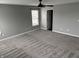 This bedroom has plush carpet, neutral-colored walls, and an en-suite bathroom at 8048 Garden Ridge Rd, Indianapolis, IN 46237
