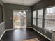 This dining area features dark floors, natural light and sliding door access to the backyard at 8048 Garden Ridge Rd, Indianapolis, IN 46237