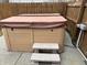 Covered hot tub near a privacy fence and concrete steps at 8048 Garden Ridge Rd, Indianapolis, IN 46237