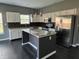 Modern kitchen featuring granite countertops, a kitchen island, and stainless steel appliances at 8048 Garden Ridge Rd, Indianapolis, IN 46237