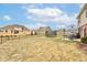 Expansive backyard with a trampoline, covered patio, and views of neighboring homes at 8218 Elsen Ridge, Avon, IN 46123