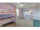 Spacious bedroom with bunk beds, a window with curtains, and a white shelf to display items at 8218 Elsen Ridge, Avon, IN 46123