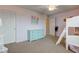 This bedroom features a light blue dresser, a bunk bed with ladder, and neutral-toned carpet at 8218 Elsen Ridge, Avon, IN 46123