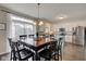 Eat-in kitchen features a dining table, stainless steel appliances, and plenty of natural light at 8218 Elsen Ridge, Avon, IN 46123
