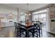 Eat-in kitchen features a dining table, stainless steel appliances, and an open concept with the living room at 8218 Elsen Ridge, Avon, IN 46123