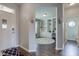 Charming entryway leading to a home office with custom shelving and a cozy bathroom down the hall at 8218 Elsen Ridge, Avon, IN 46123