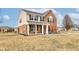 Attractive two-story home featuring brick and siding, a covered porch, and a spacious front yard at 8218 Elsen Ridge, Avon, IN 46123