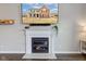 Close-up view of the living room fireplace and mantel with a wall-mounted TV above it at 8218 Elsen Ridge, Avon, IN 46123