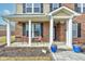 Inviting front porch with seating and charming architectural details at 8218 Elsen Ridge, Avon, IN 46123