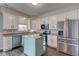 Bright kitchen with stainless steel appliances, a center island, and white cabinets at 8218 Elsen Ridge, Avon, IN 46123