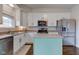 Bright kitchen with stainless steel appliances, a center island, and white cabinets at 8218 Elsen Ridge, Avon, IN 46123