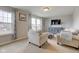 Cozy living room with natural light, plush seating, neutral color palette, and a TV at 8218 Elsen Ridge, Avon, IN 46123