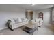 Cozy living room showcasing neutral tones, comfortable seating, and stylish coffee table at 8218 Elsen Ridge, Avon, IN 46123